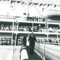 Dr and Mrs William B Walsh walking down the gangway upon arrival in Maceio.